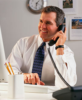Funeral planner on telephone