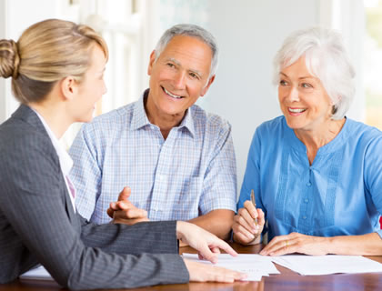 Elderly couple meeting with funeral planner